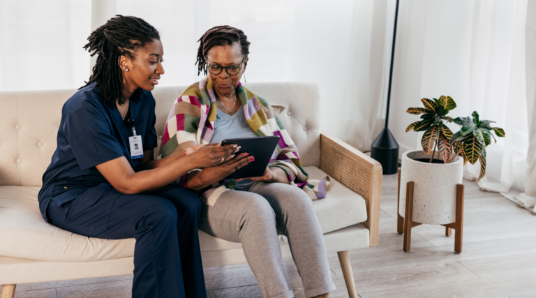 decorative: caregiver assisting patient with ipad